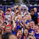 Apr 4, 2022; New Orleans, LA, USA; Kansas Jayhawks fans celebrate after their win over the North Carolina Tar Heels in the 2022 NCAA men's basketball tournament Final Four championship game at Caesars Superdome. Bob Donnan-USA TODAY Sports